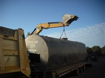10,000 Gallon tank being safely transported for disposal